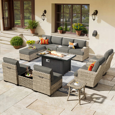 14- Person Rattan Outdoor Seating Group With Swivel Rockers and Fire Pit Table