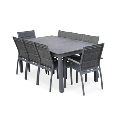 Woodcliff 8 - Person Patio Dining Set with Extendable Rectangular Table , Cushions Included