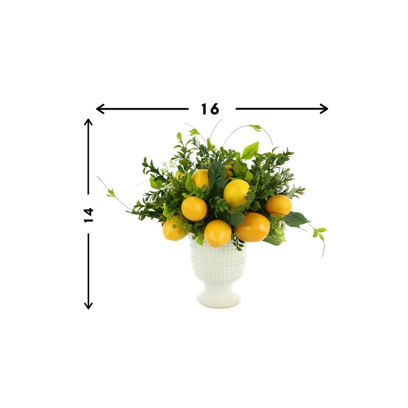 Lemon And Boxwood Arrangement In A Ceramic Pot