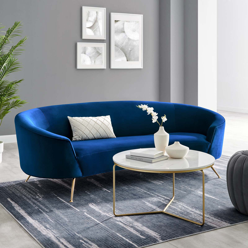 Navy Velvet Curved Sofa with Gold Legs and Sloped Arms