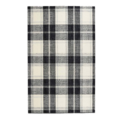 Tapis tissé à carreaux noir et blanc