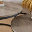 Ensemble de tables basses gigognes avec deux tables rondes, structure en métal industriel et finition en bois gris classique, idéal pour les petits salons