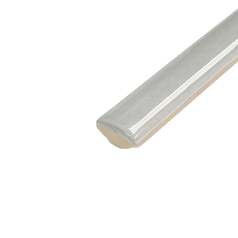 Coco Demi-Bullnose 1/2 In. X 7-7/8 In. Ceramic Wall Trim, Glossy Amber Gray