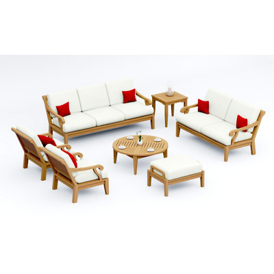 Ensemble de canapé en bois de teck 7 pièces Teakstation: canapé, 2 chaises longues, repose-pieds, table basse ronde, table d'appoint et causeuse avec coussins en tissu Sunbrella extérieur # 5404 naturel