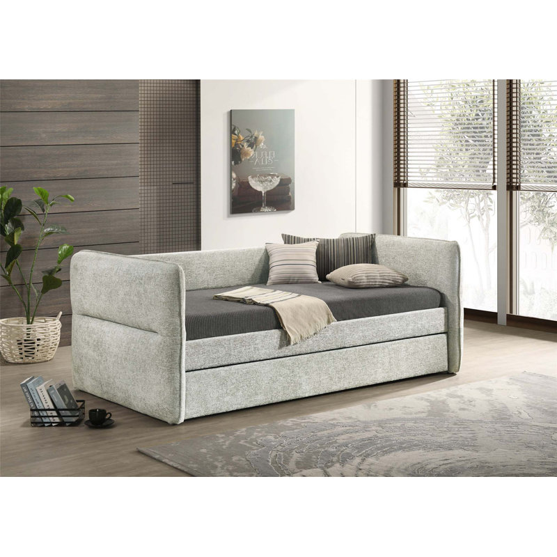 Modern Daybed with Pull-Out Trundle, Button Tufting, and Nailhead Trim for Versatile Living and Guest Accommodation.