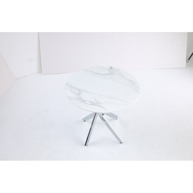 Le plateau de table circulaire en verre trempé moderne est jumelé à un cadre en fer argenté, mesurant 35,43 pouces de longueur.