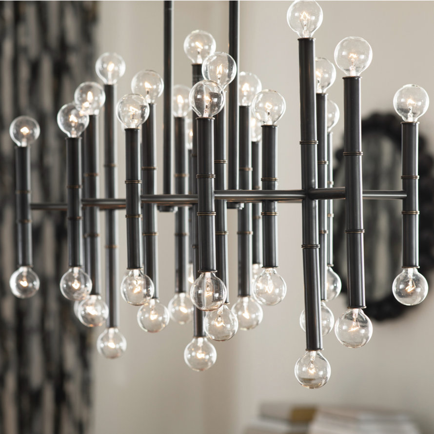 Chandelier with round light bulbs attached to black rods.