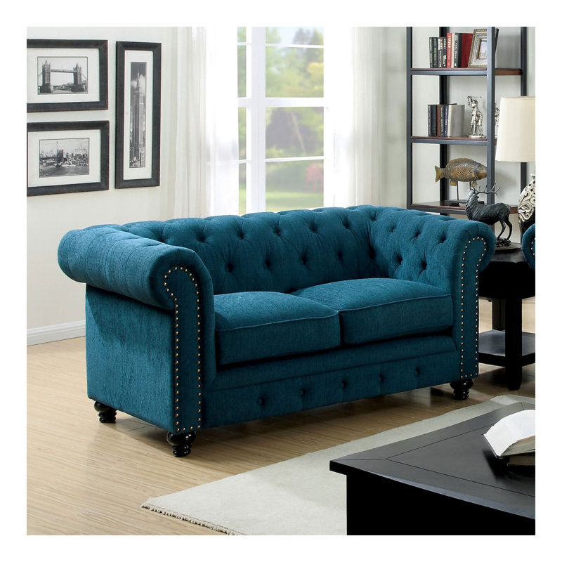 Causeuse contemporaine capitonnée de couleur bleu sarcelle à boutons capitonnés et capitonnée