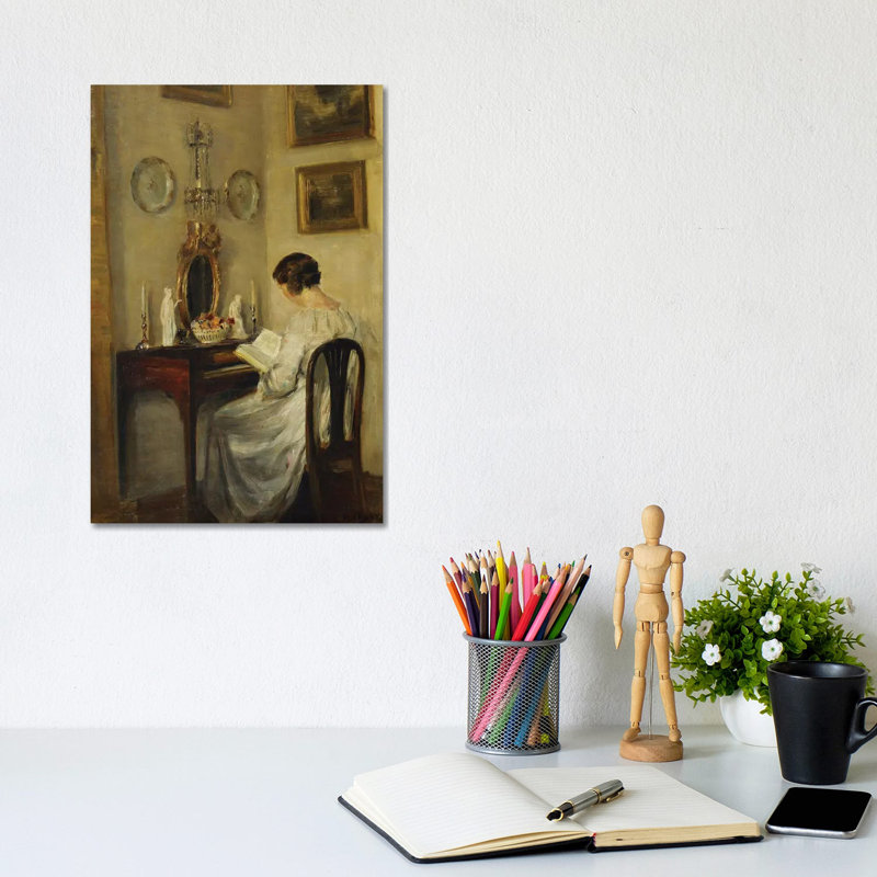 An Interior With A Girl Reading At A Desk by Carl Holsoe - Wrapped Canvas Gallery-Wrapped Canvas Giclée