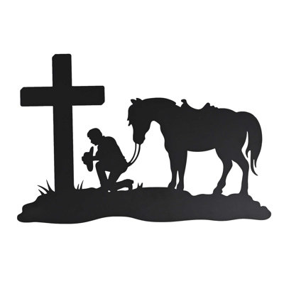 Cowboy en métal suspendu à la croix