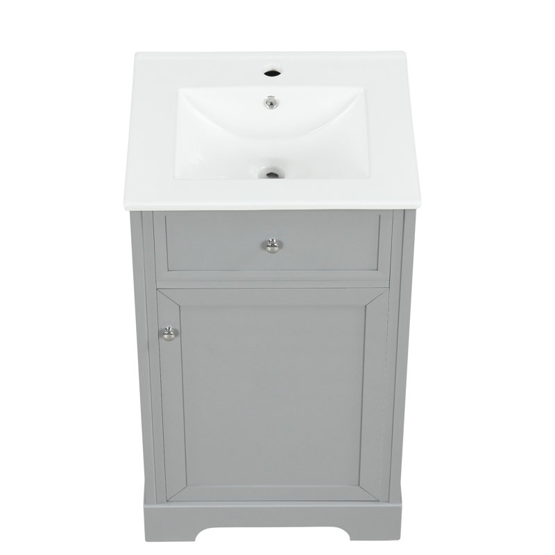 Meuble-lavabo de 20 po avec lavabo, gris. Panneau robuste, lavabo en céramique. Porte à fermeture douce de l'armoire, tablette réglable pour le rangement. Composant moderne de teinte grise. Résistant et lavabo. Porte et tablettes de rangement.