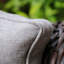 Chaise berçante d'extérieur en osier avec coussins Hayslett