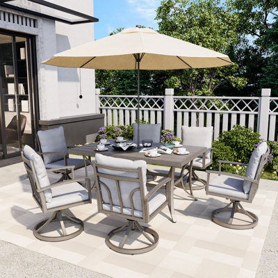 Freada 6 - Person Patio Dining Set Umbrella Hole Included Rectangular Table with Cushions Included