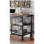 Bureau d'inspiration industrielle avec un plateau en bois noir antique et des roulettes décoratives