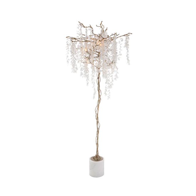 Floor lamp with a decorative metal branch frame featuring cascading clear crystal accents and a white marble cylindrical base.