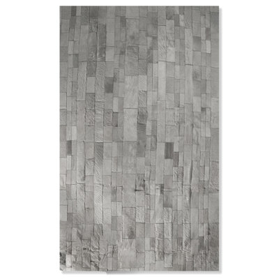 Sarthak Cowhide Animal Print Indoor Rug