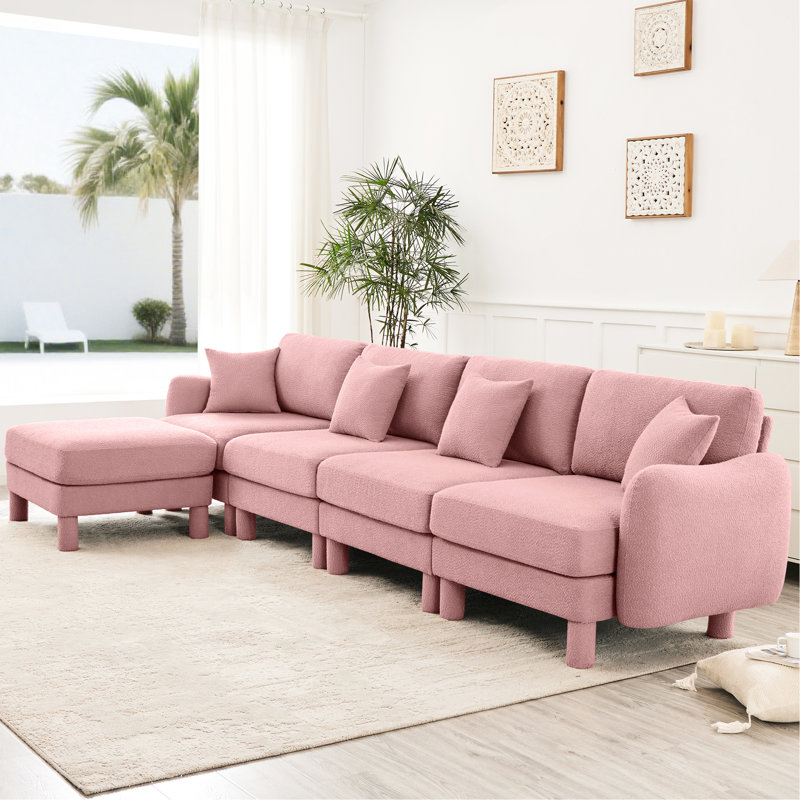 Tissu convertible en L rose à 4 places avec pieds en forme de coquillage, amovibles et cylindriques. Conception de conception moderne pour le confort de votre salon dans la chambre à coucher