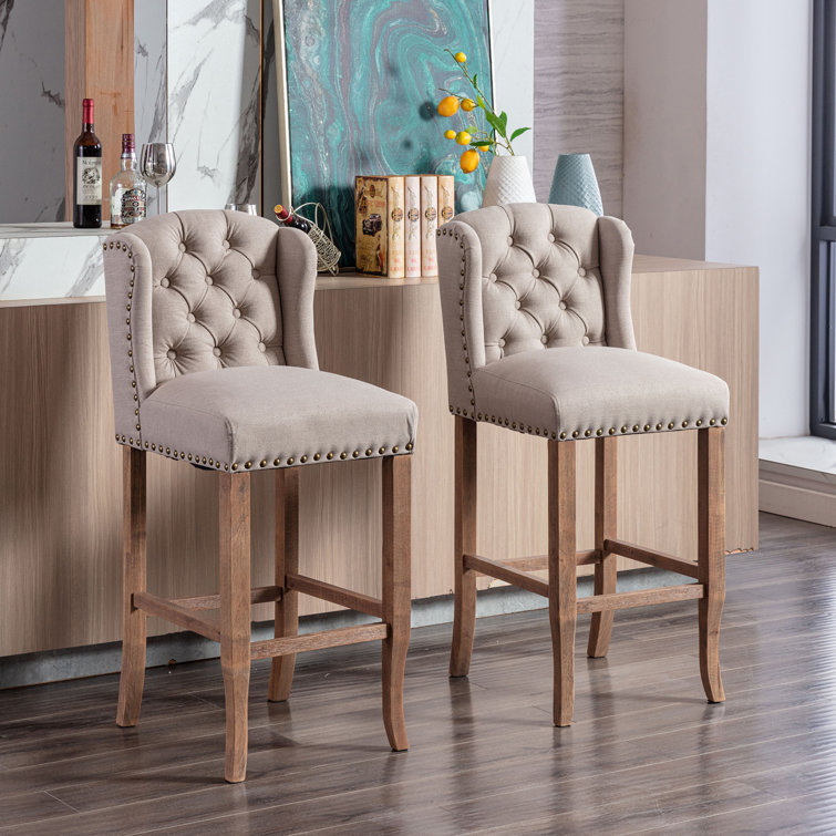 https://assets.wfcdn.com/im/19513143/resize-h755-w755%5Ecompr-r85/2124/212484209/Otteridge+Upholstered+Counter+Height+Bar+Stools%2C+Breakfast+Chairs+with+Nailhead-Trim%2C+Wood+Legs.jpg