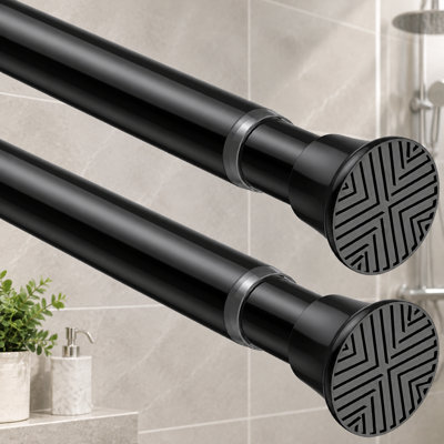 Un ensemble 2 pièces de petites tringles de douche à ressort noires réglables de 18 à 36 pouces; La conception extensible sans perceuse est conçue pour les salles de bain, les fenêtres, les placards, les cuisines, les portes et les chambres à coucher.