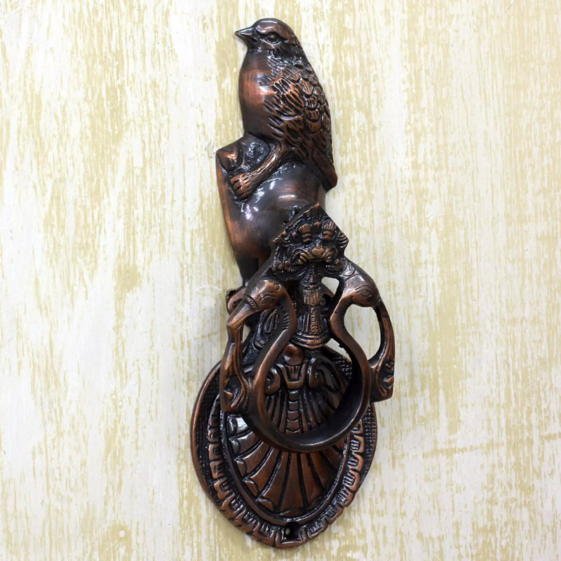 Porte-dessus de porte plaquée en cuivre aviaire melody Edgemere