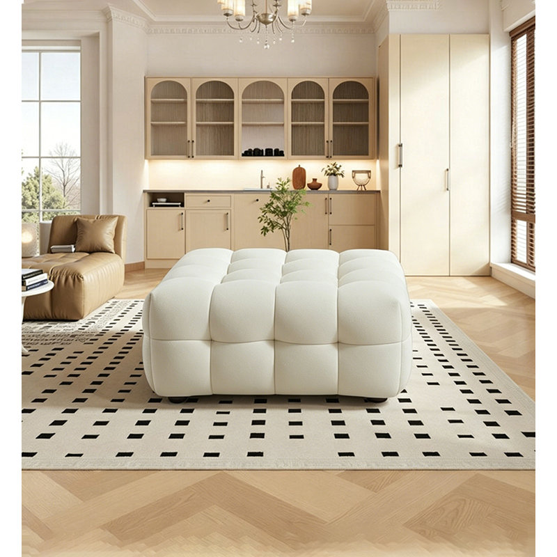 Repose-pieds moderne et bouclé crème pour le salon