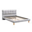 Lit plateforme gris avec tête de lit en forme de biscuit, fabriqué en matériaux robustes pour la durabilité