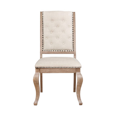 De 2 chaises de salle à manger en tissu crème et ornements bruns