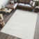 Yaniyah Classic Solid Low-Pile Machine-Washable Cream Rug