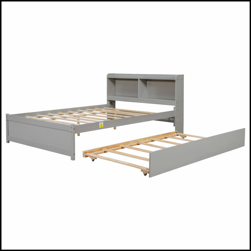 Lit avec lit gigogne et bibliothèque intégrée, parfait pour économiser de l'espace et du rangement dans les chambres compactes.