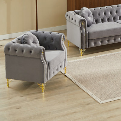 Fauteuil Chesterfield en velours avec boutons capitonnés