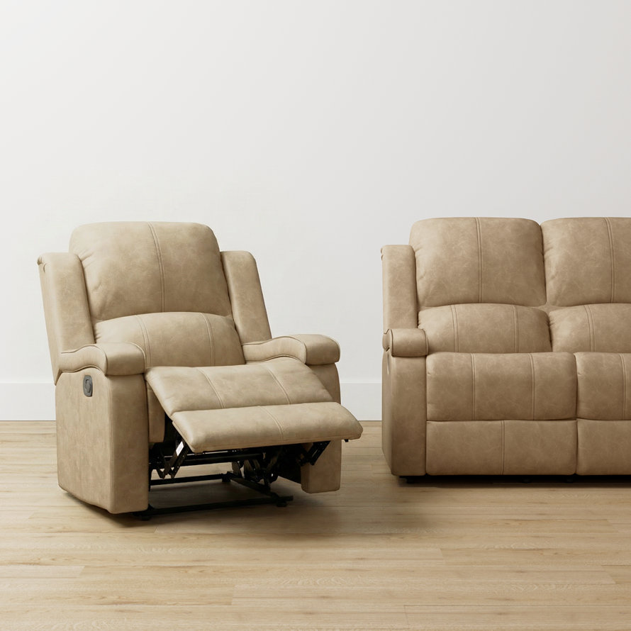 Beige recliner chair and sofa on wood floor.
