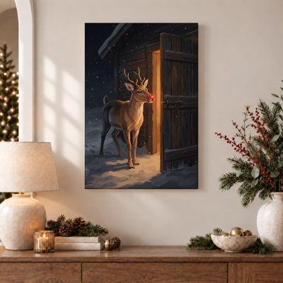 Toile de Noël renne enneigé avec nez rouge brillant sur une porte de grange