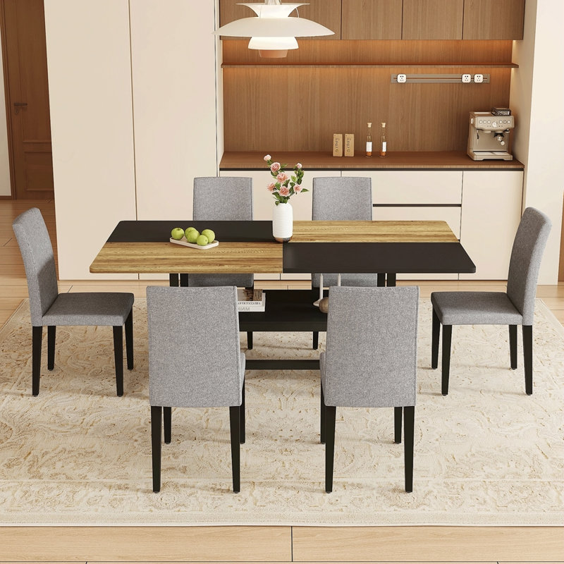 Ensemble de table et de chaises.Une table de salle à manger circulaire épissée de couleur moderne - Rangement double couche. Combinée avec des chaises en tissu brun, simples et polyvalentes, confortables.