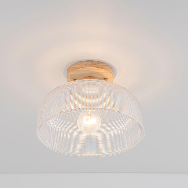 Plafonnier à une lumière avec grille en verre, fini texturé bois et abat-jour en verre transparent.