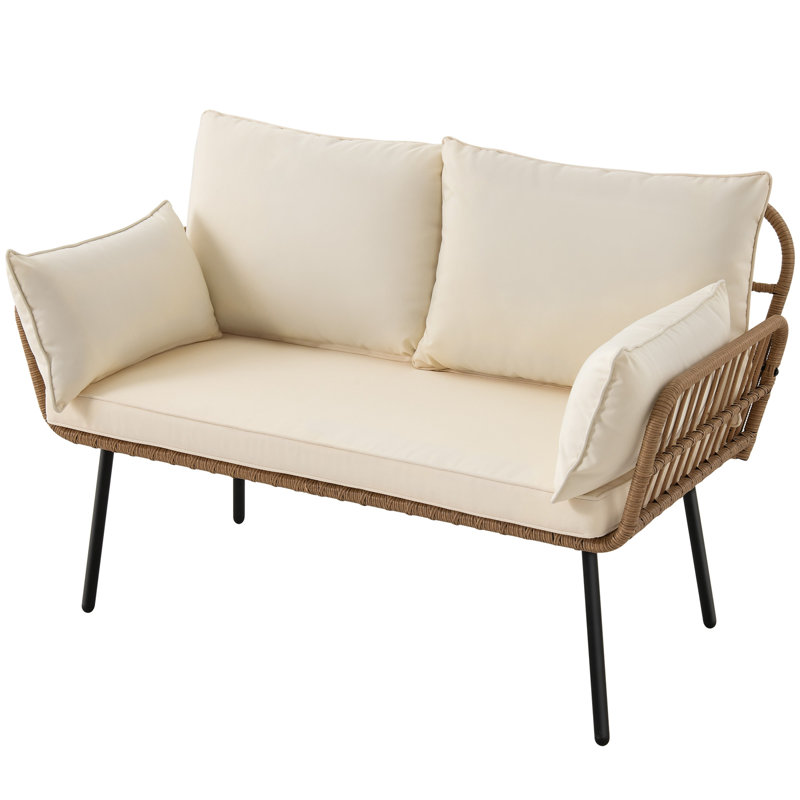 wicker modern patio love seat with cream cushions