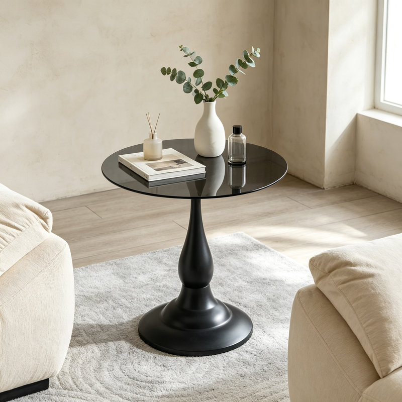 Table d'appoint vintage en métal noir mat, plateau rond en verre trempé gris translucide de 50 cm, pied en forme de vase, idéale pour le salon ou la chambre.