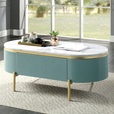 Table basse moderne élégante bleu sarcelle avec plateau effet marbre blanc et tiroir dissimulé.