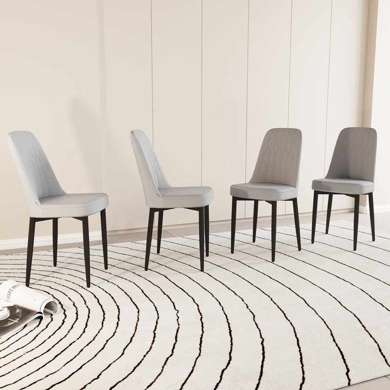 Ensemble de 4 chaises de salle à manger élégantes et confortables avec un design ergonomique et un dossier courbé, parfait pour les intérieurs modernes