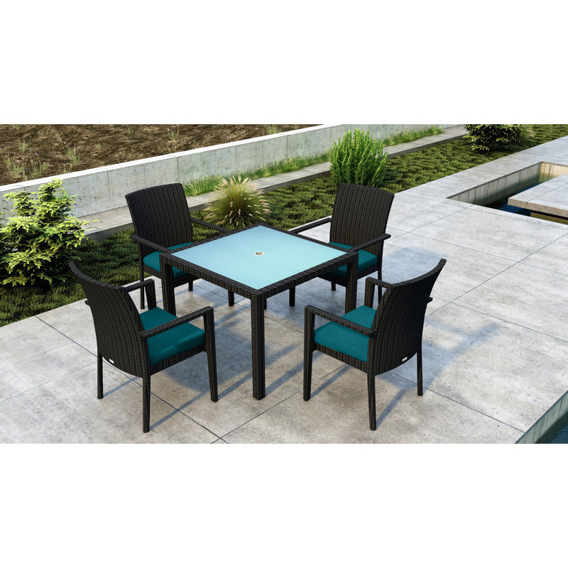 Thornaby 4 - Person Wicker Patio Dining Set with Square Table, Spectrum Peacock Sunbrella® Plainweave