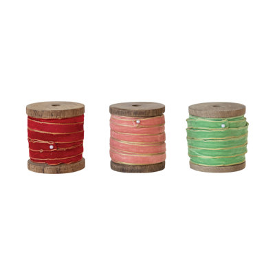 Ruban de velours avec bords métalliques sur bobine de bois