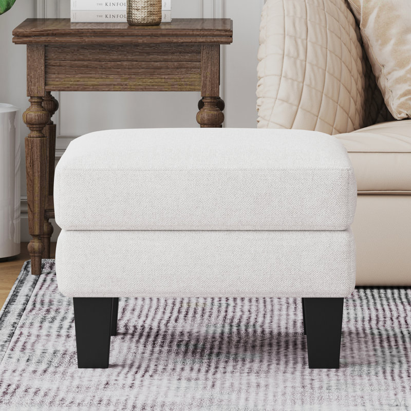 Repose-pieds en tissu beige