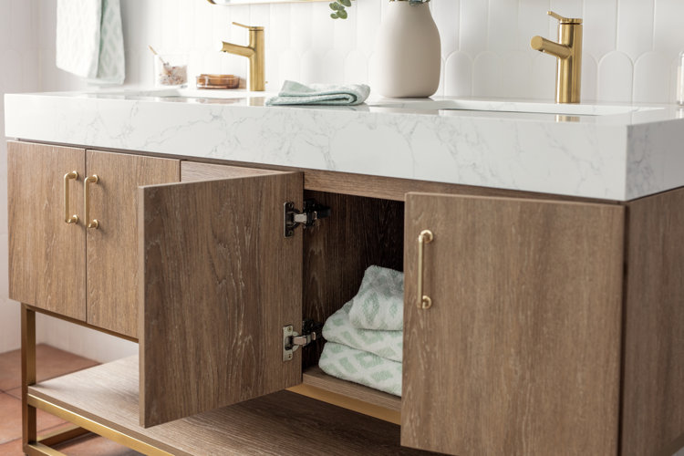 modern wood bathroom vanity with a door open, showing light green towels