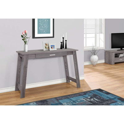 Bureau d'ordinateur contemporain avec stratifié gris avec rangement, parfait pour le bureau personnel et le travail sur ordinateur portable.