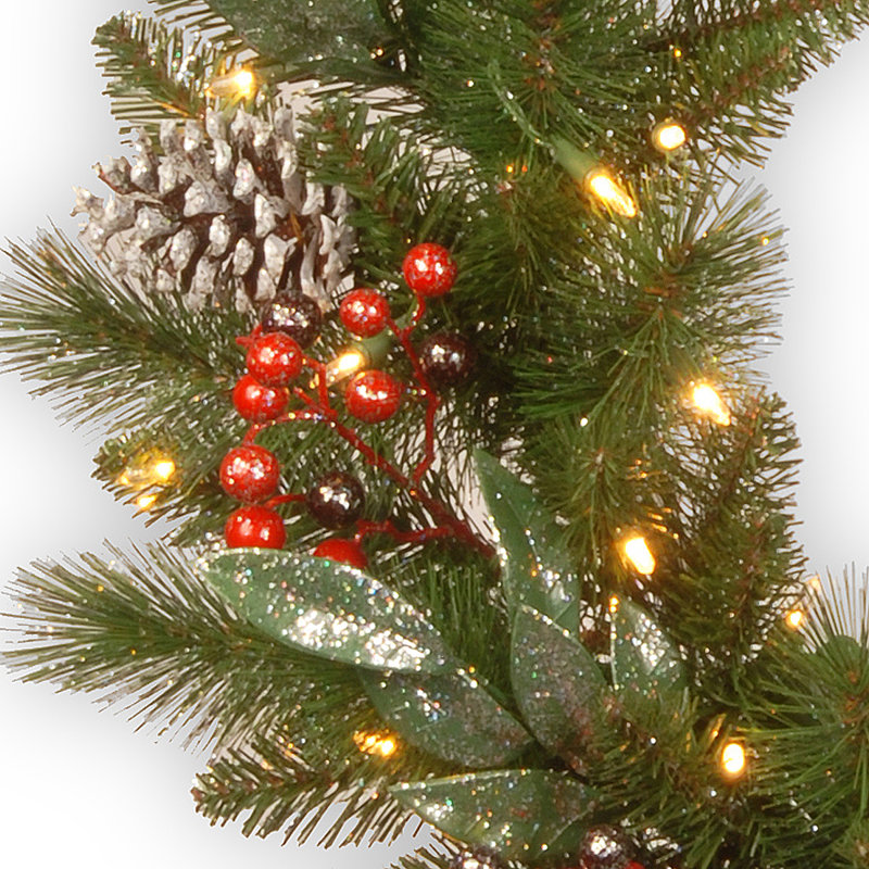 The Holiday Aisle® Frosted Pine Berry Wreath with Battery Operated LED Lights, 24" H x 24" W x 4" D