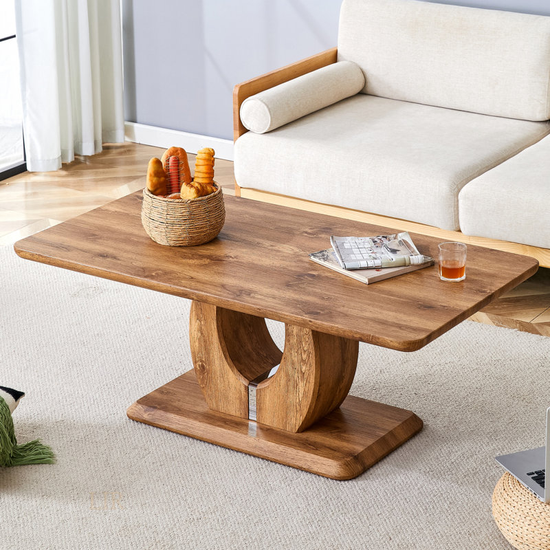 Table basse moderne et simple de luxe moderne, polyvalente pour manger, travailler et jouer dans divers décors.