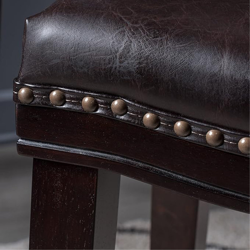 Contemporary Upholstered Saddle Counter Stool With Nailhead Trim And Elegant Design, Ideal For Kitchen And Bar Areas.