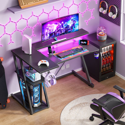 Shaped Gaming Computer Desk with LED Lights, Power Outlet, Monitor Stand, 3-Tier Storage Shelves & Carbon Fiber Surface, Gamer Desk