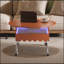 Table basse ronde à plateau relevable avec roues, structure en métal et éclairage multicolore personnalisable, parfaite pour les salons modernes