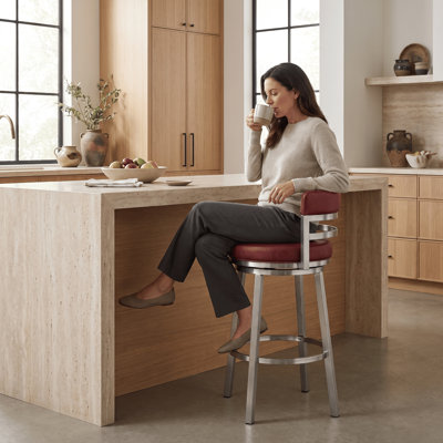 Deherrera Modern Swivel Counter or Bar Stool with Open Low Back and Footrest in Metal and Faux Leather