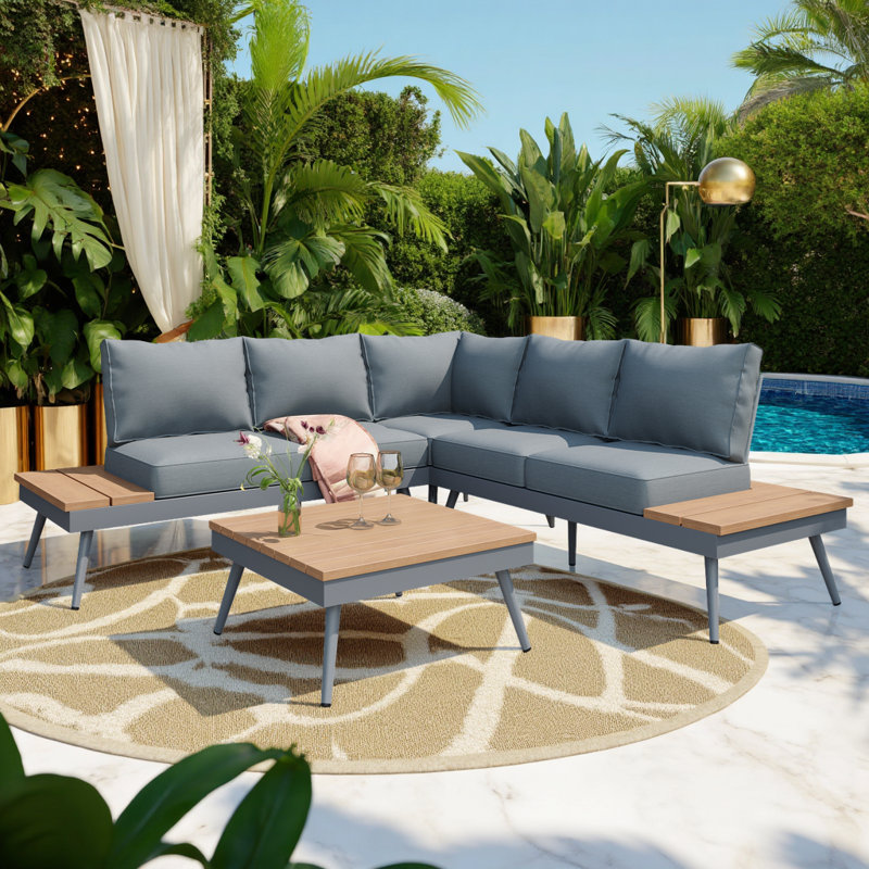 Ensemble de canapé modulaire d'extérieur 4 pièces résistant aux intempéries avec table en faux bois, dossier en filet et coussins